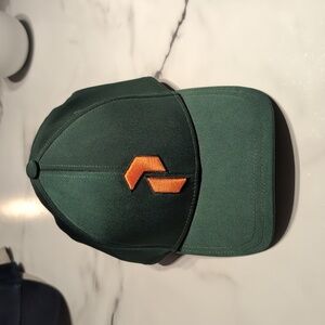 Peak Performance Green Cap with Orange Logo